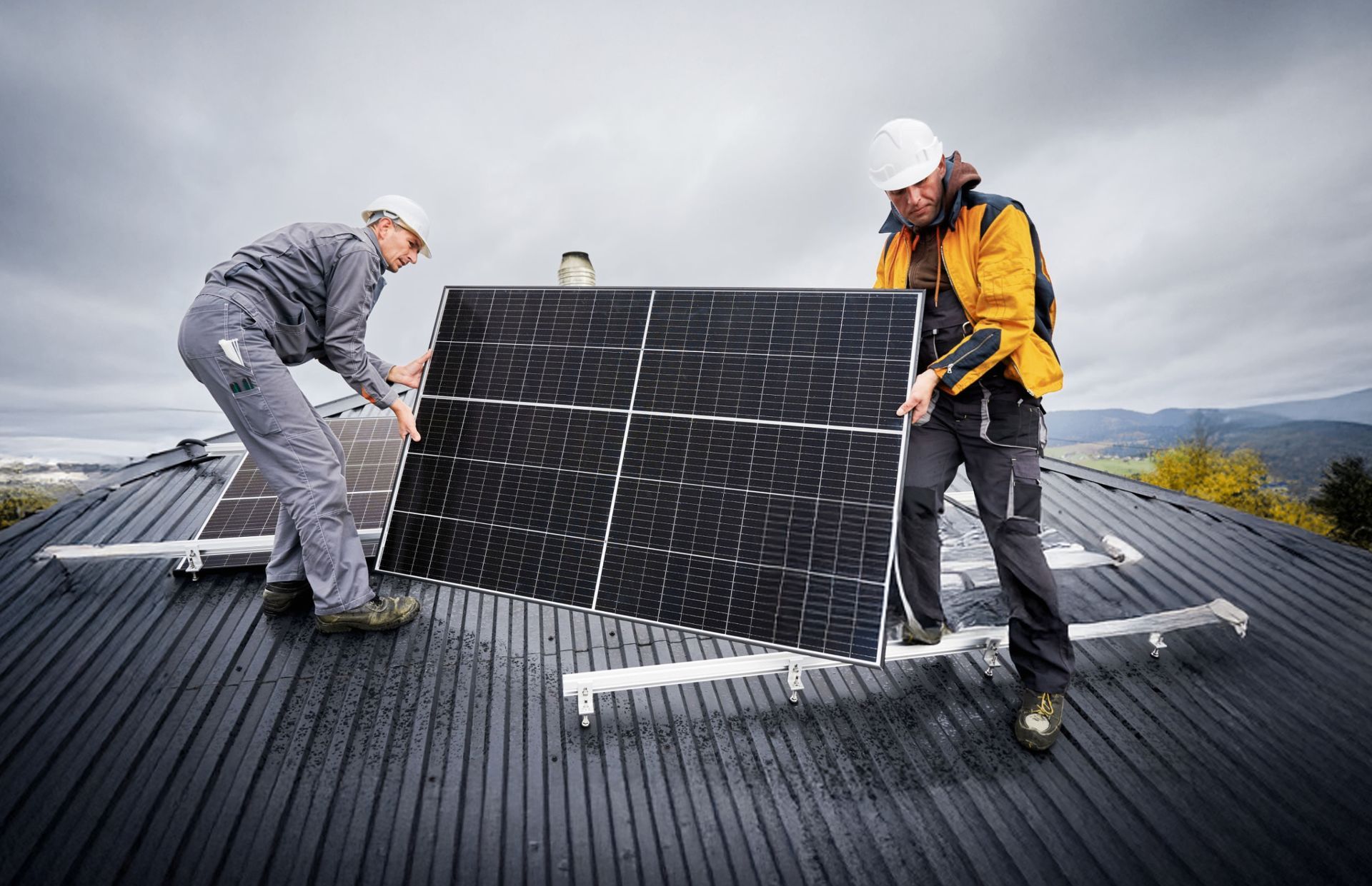 Solar panels installed on Arizona residential rooftop with terracotta tiles under bright blue sky